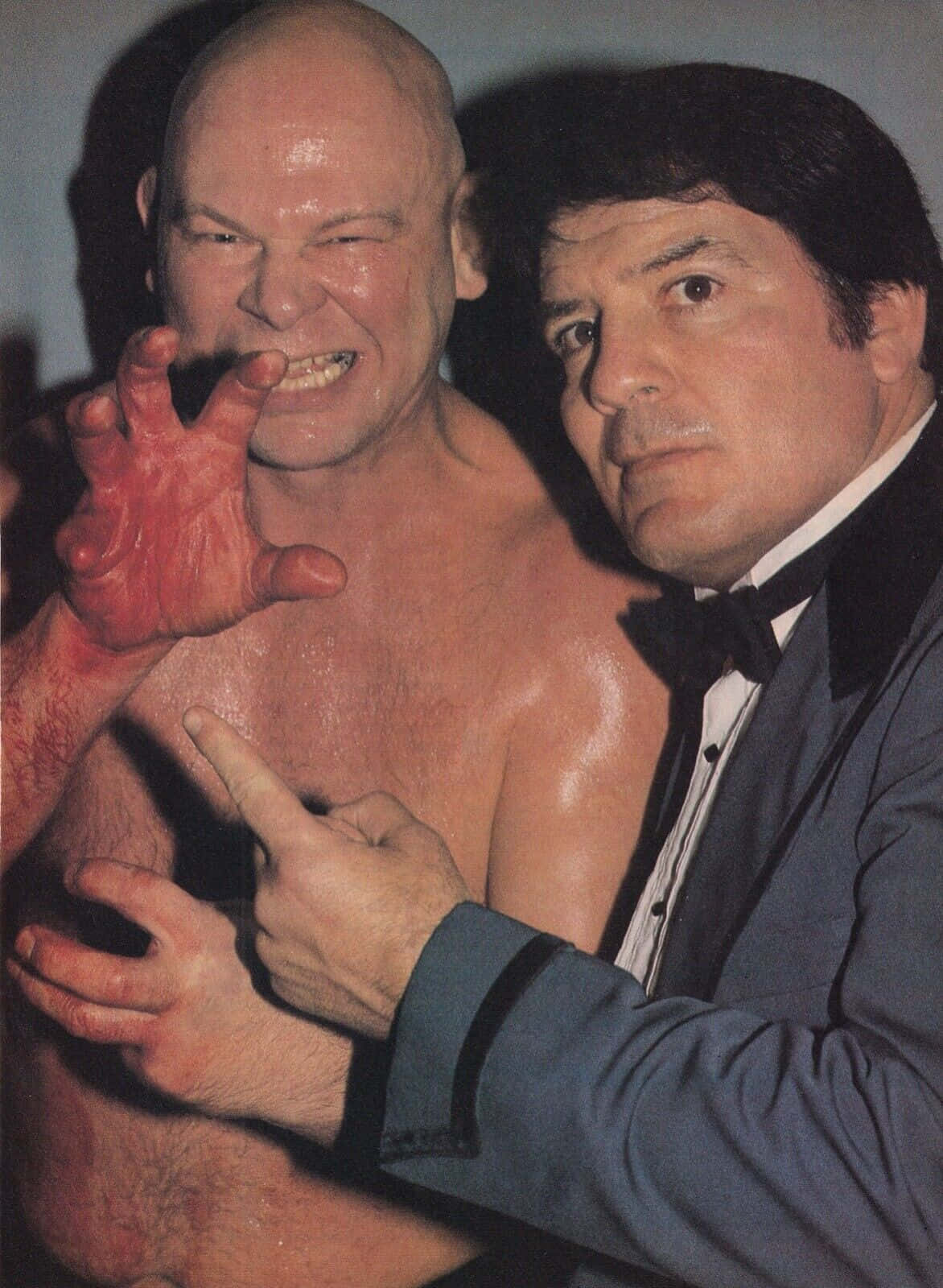 Wrestler Baron Von Raschke The Claw Posing With A Colleague Wallpaper