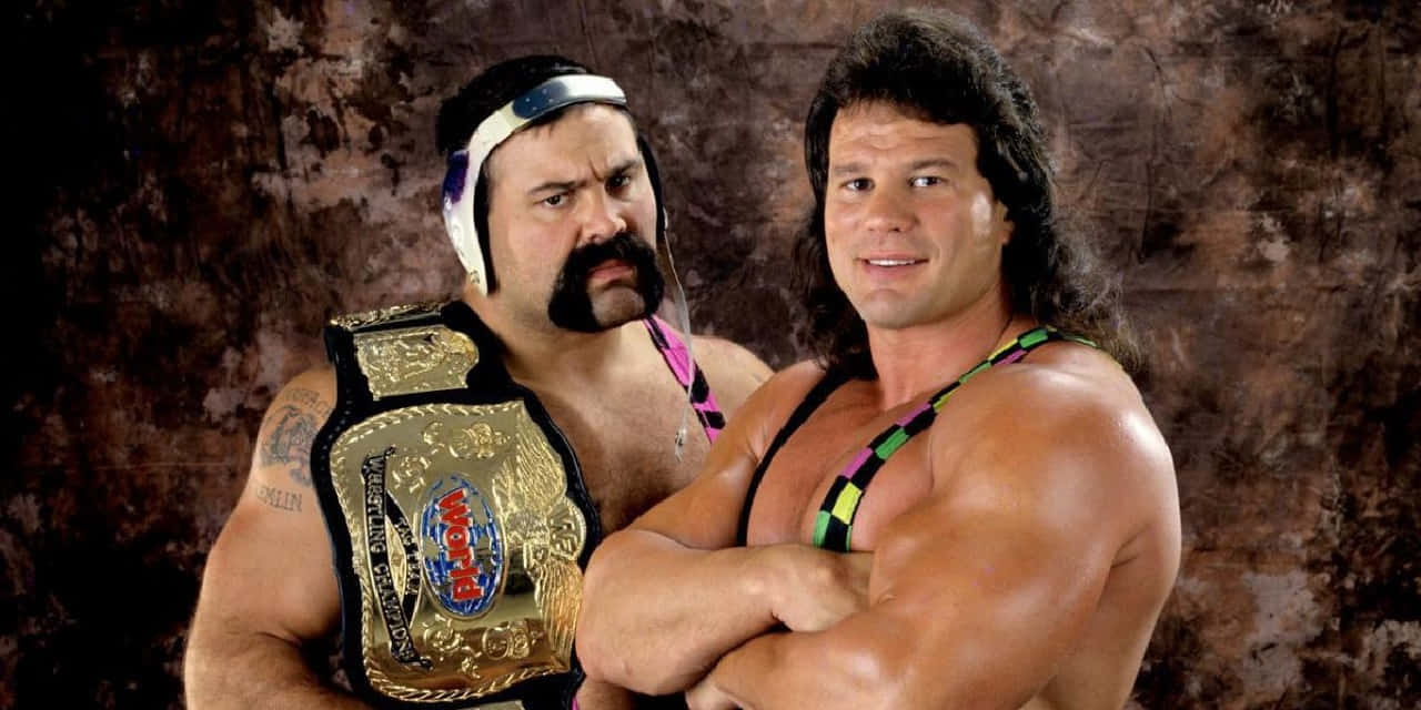 Wrestling_ Champions_ Posing_with_ Belt Wallpaper