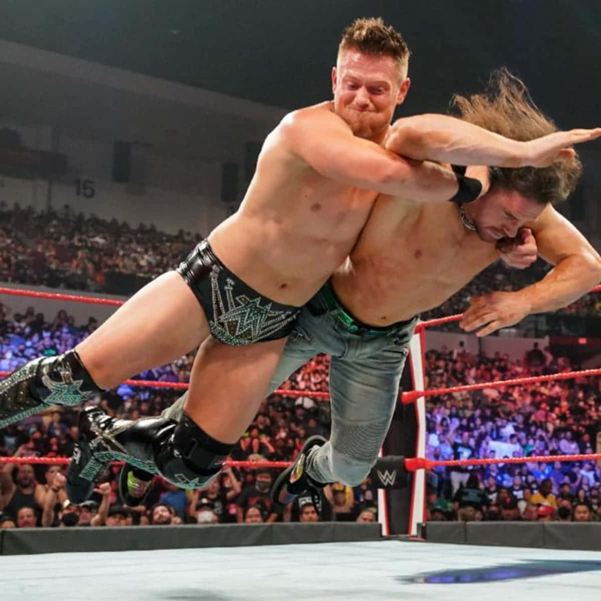 Wrestling Pro John Morrison In Action Against The Miz Wallpaper