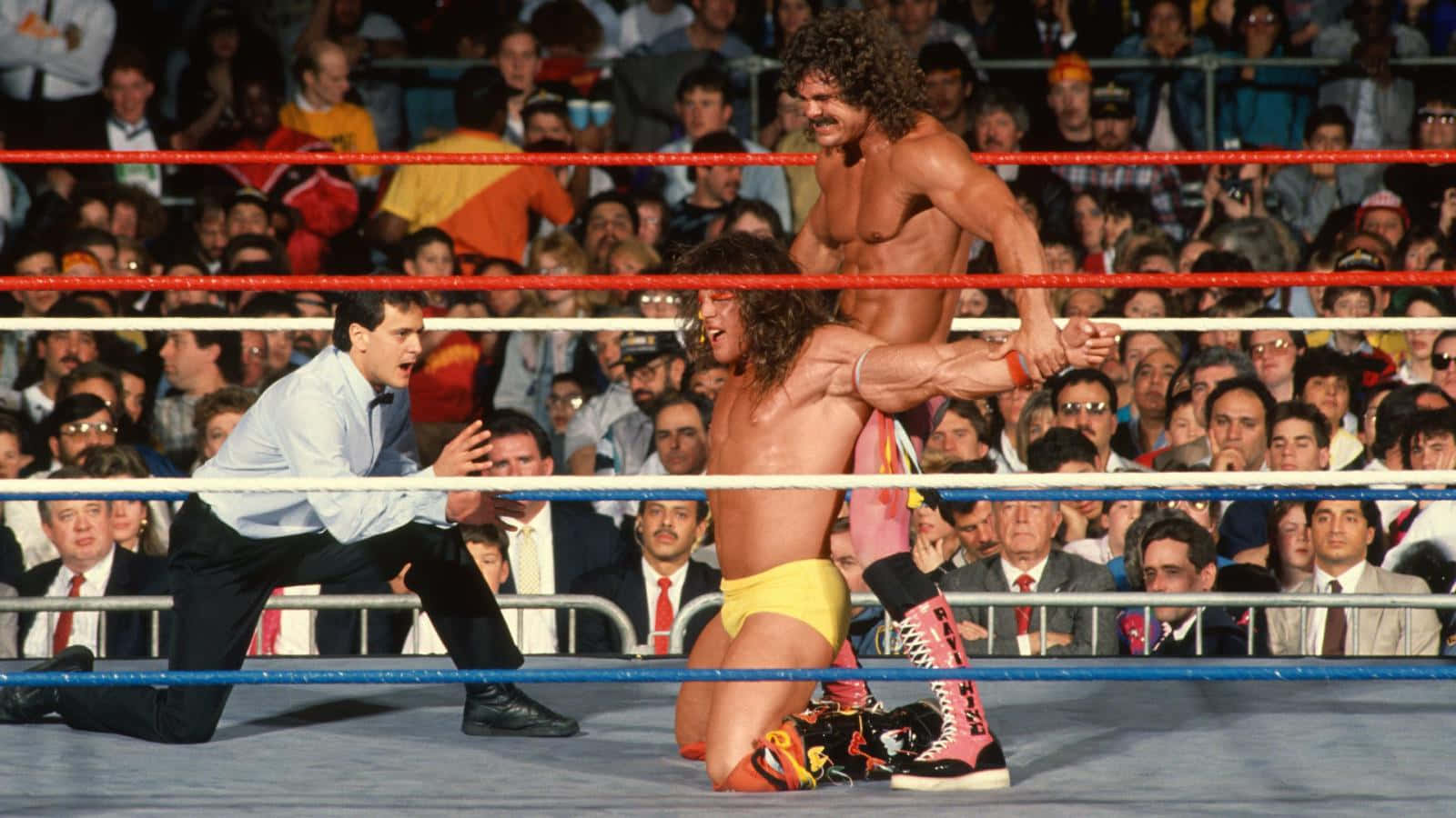 Wwe Legend Rick Rude Exhibits His Charismatic Persona At Wrestlemania V. Wallpaper