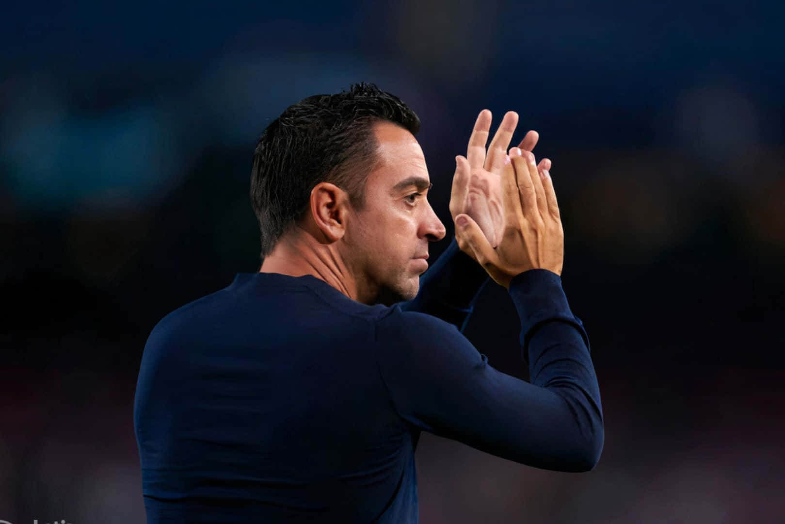 Xavi Hernandez Clappingon Sideline Wallpaper