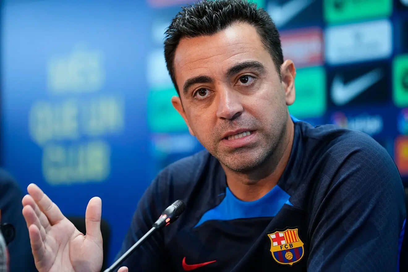 Xavi Speakingat Press Conference Wallpaper