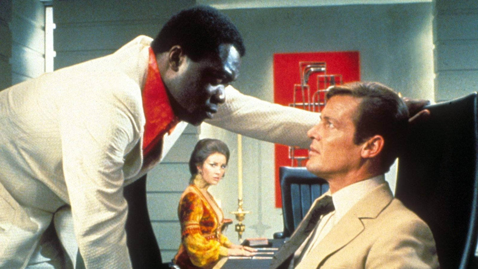 Yaphet Kotto And Roger Moore Doing A Scene Wallpaper