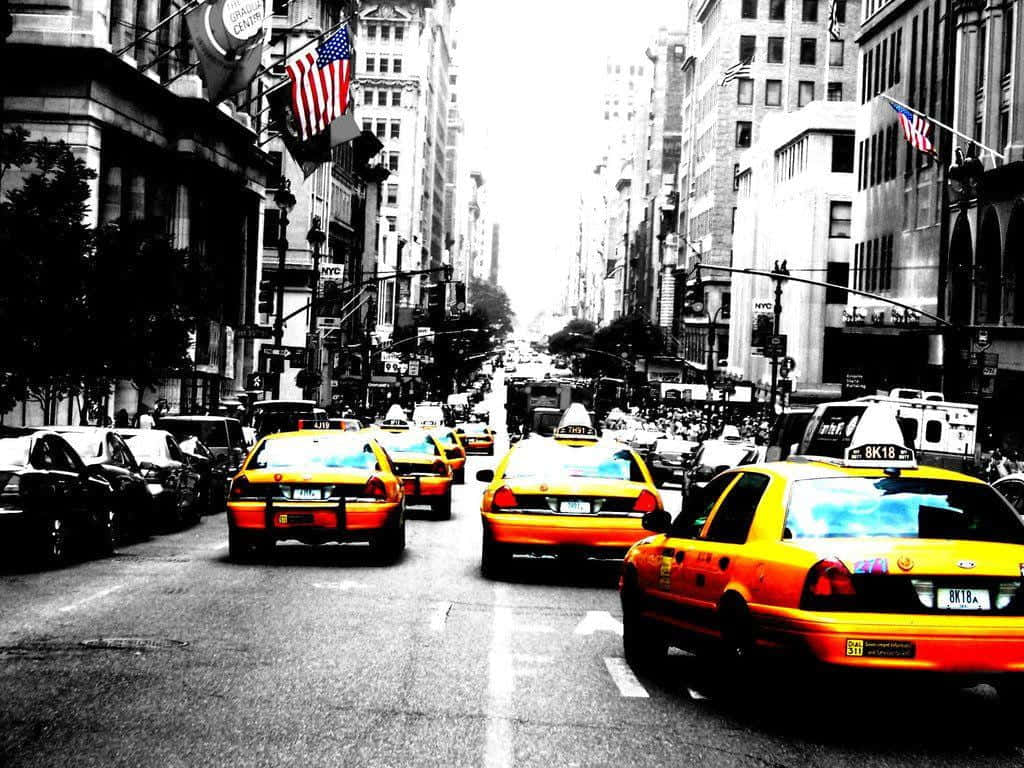 Yellow Cab In The Busy City Streets Wallpaper