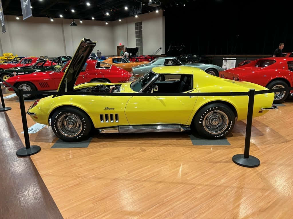 Yellow Chevrolet Corvette Stingray Classic Car Show Wallpaper