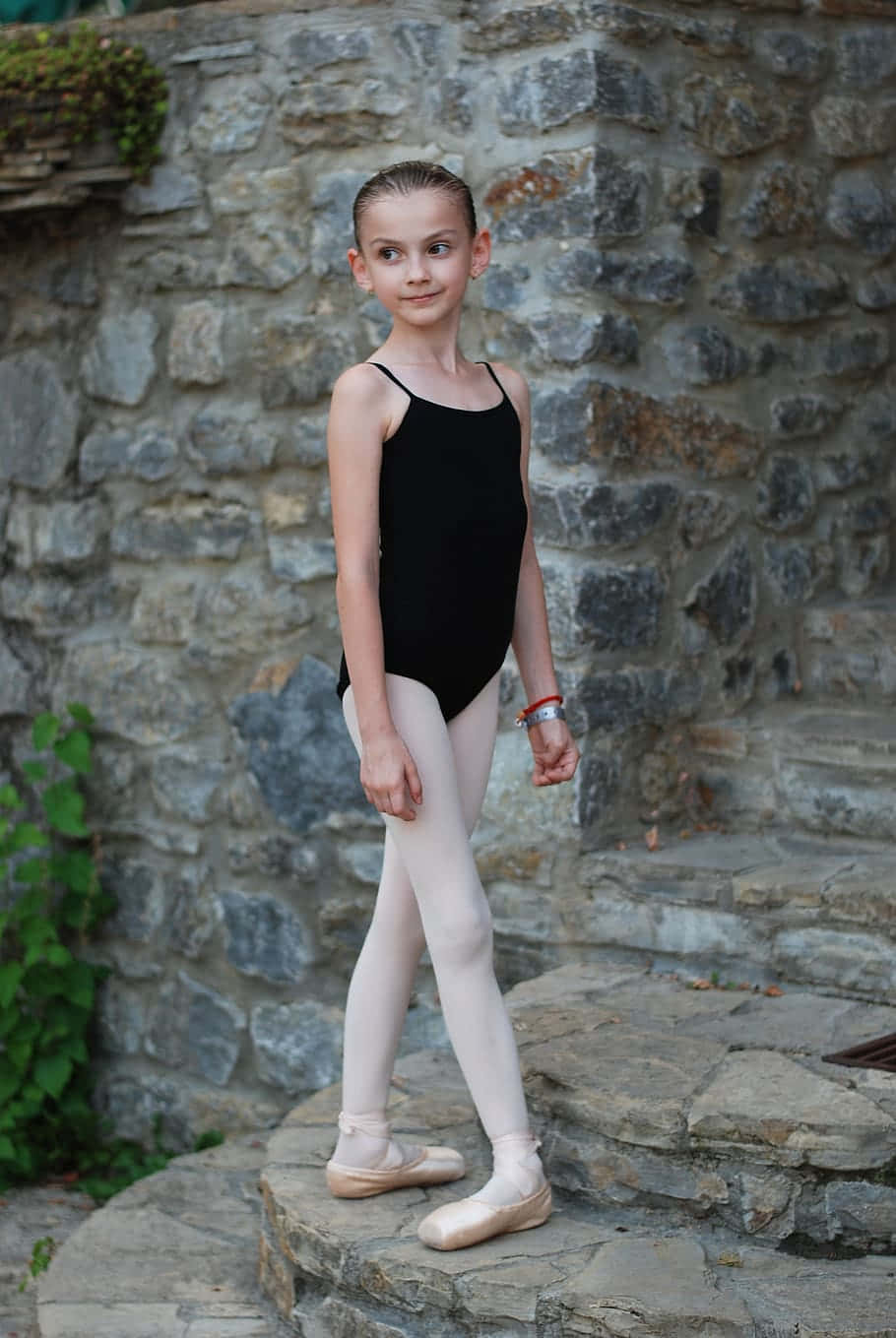 Young Ballerina Stone Backdrop Wallpaper