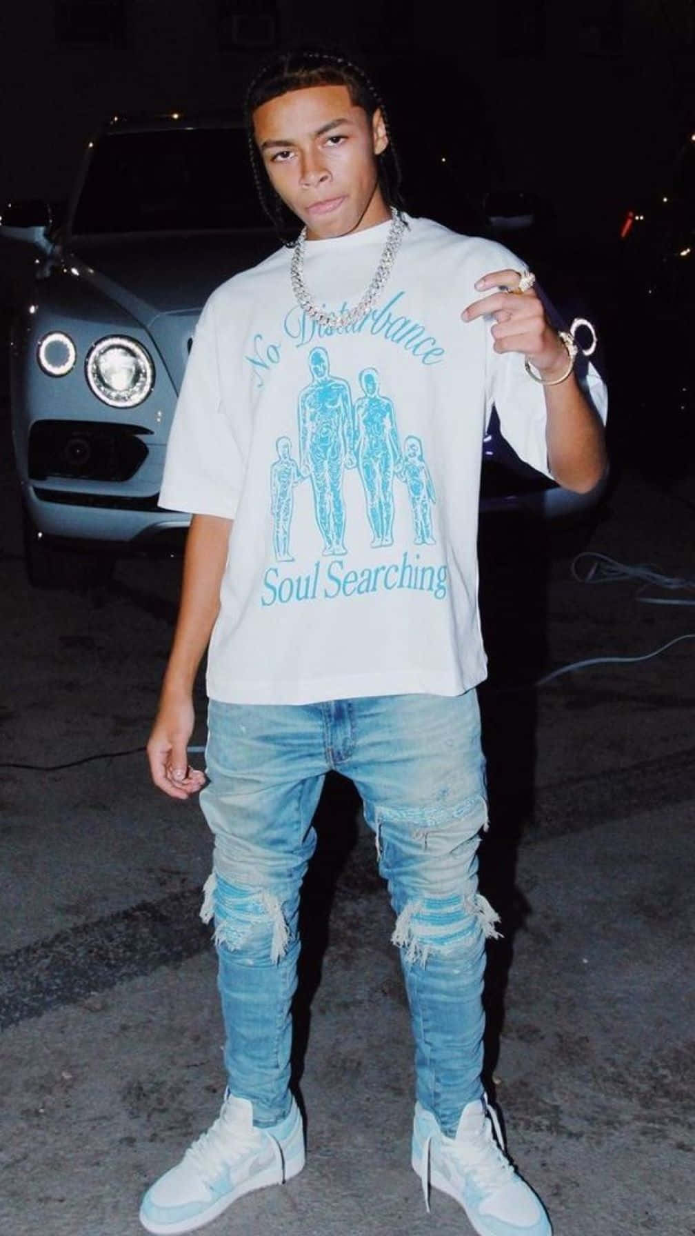 Young_ Man_in_ White_ Tshirt_and_ Denim Wallpaper