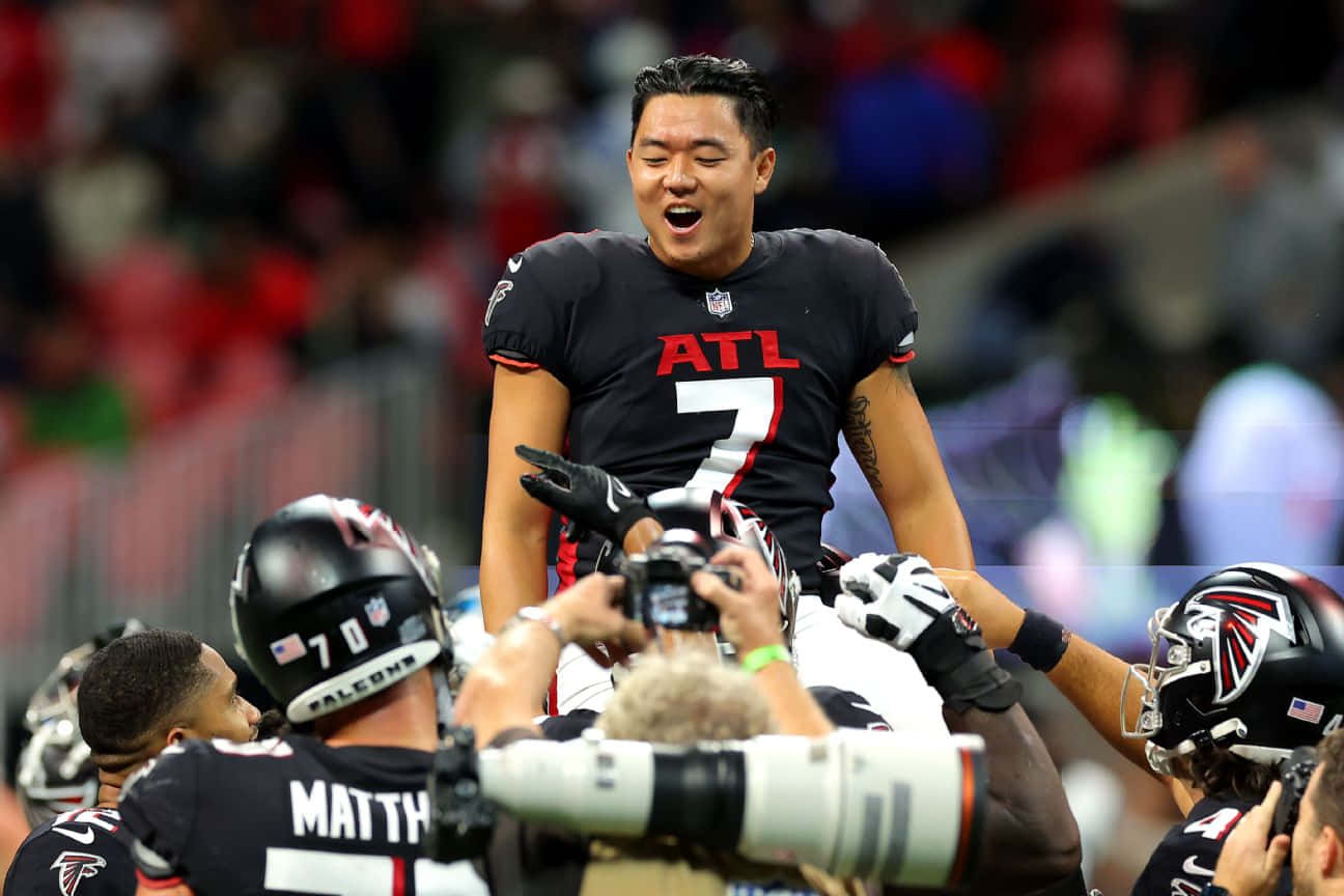 Younghoe Koo Celebrationwith Atlanta Falcons Teammates Wallpaper