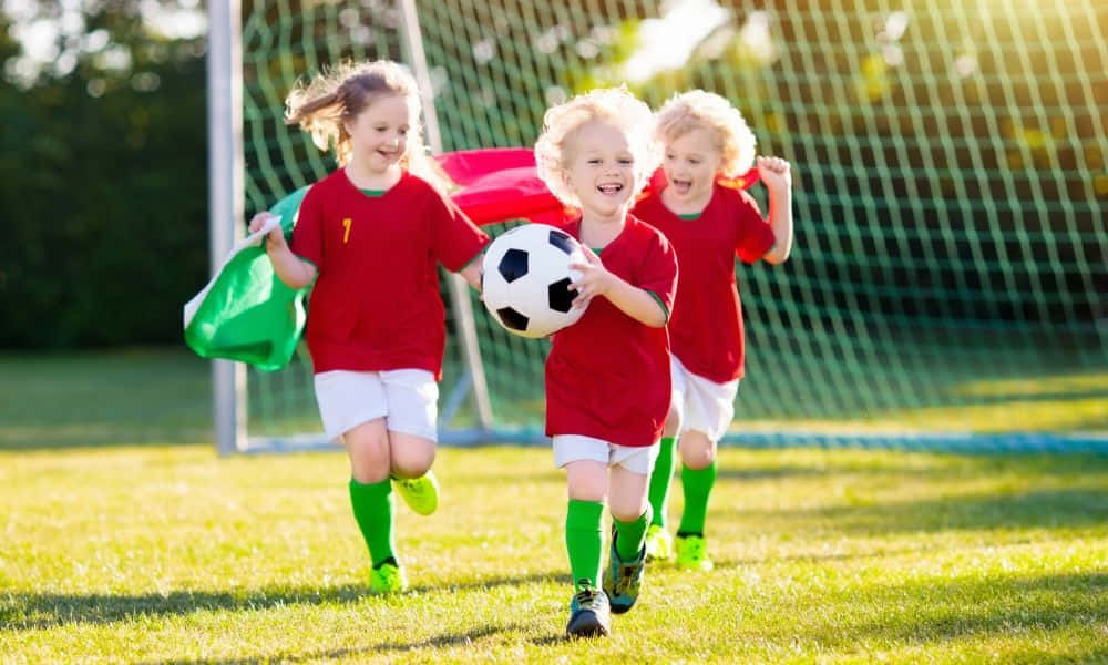 Youth Soccer Team Celebration Wallpaper