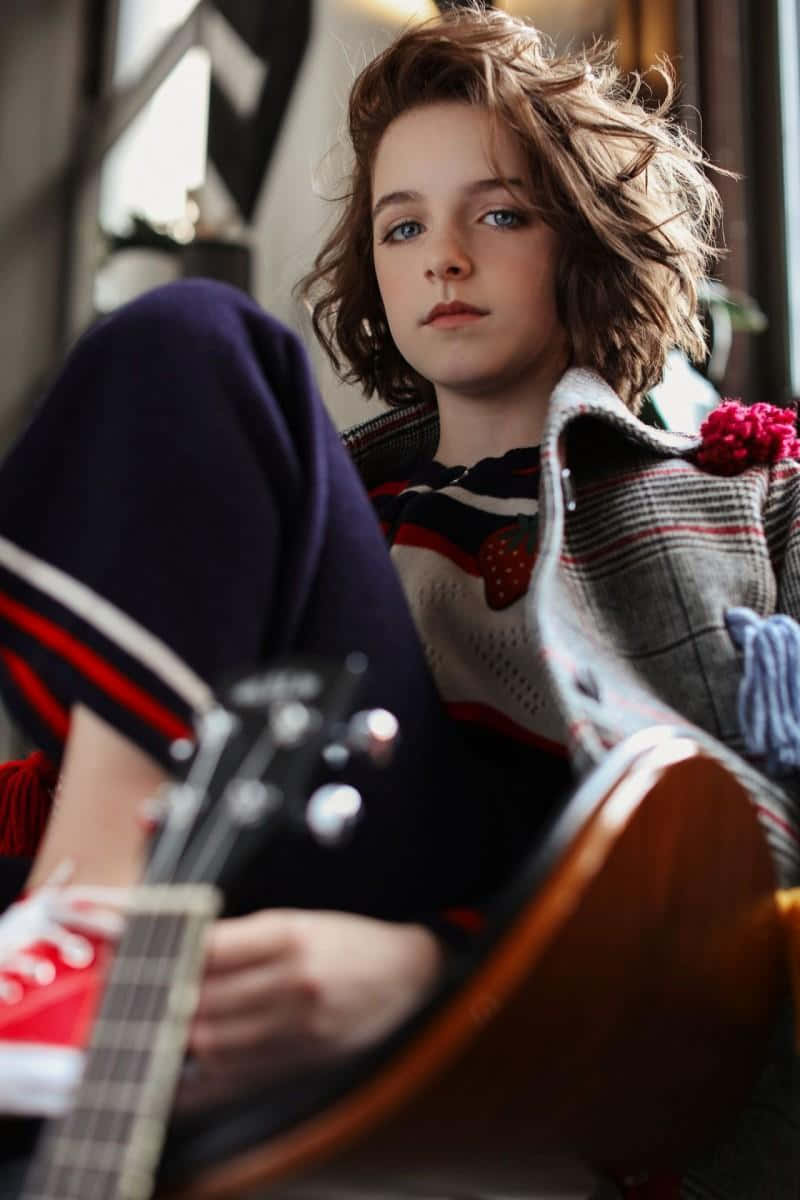 Youthful Musician Portrait Wallpaper