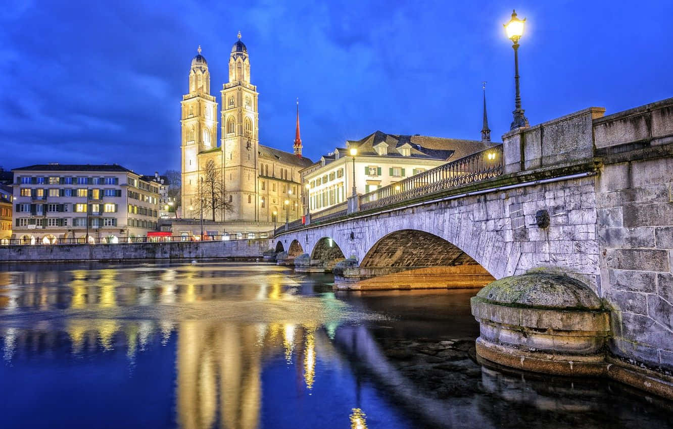 Zurich Riverfront Twilight View Wallpaper