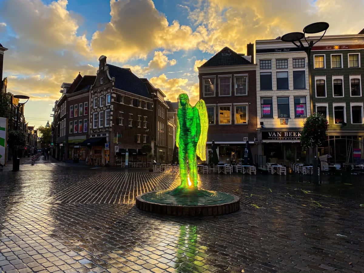 Zwolle Glowing Angel Statueat Dusk Wallpaper