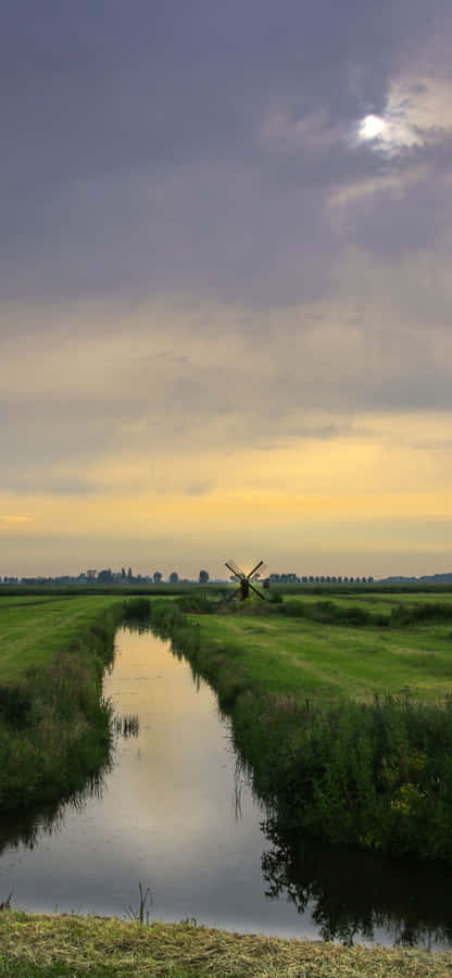 A Beach Landscape Of Rocky Cliffs And Crystal Blue Water. Wallpaper