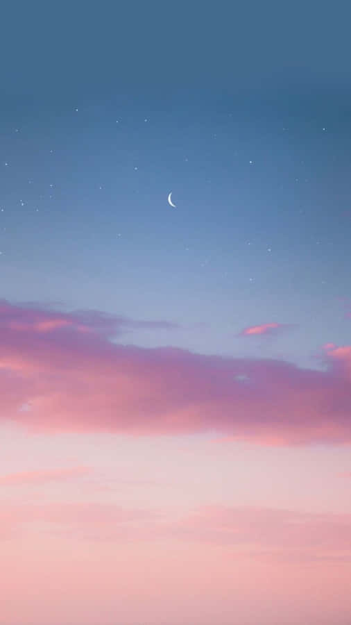 A Beautiful Landscape Of Pink And Blue Hues Wallpaper