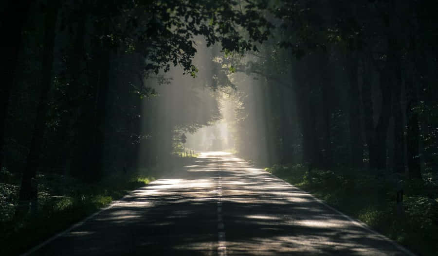 A Beautiful Sunrise Over The Clouds Wallpaper