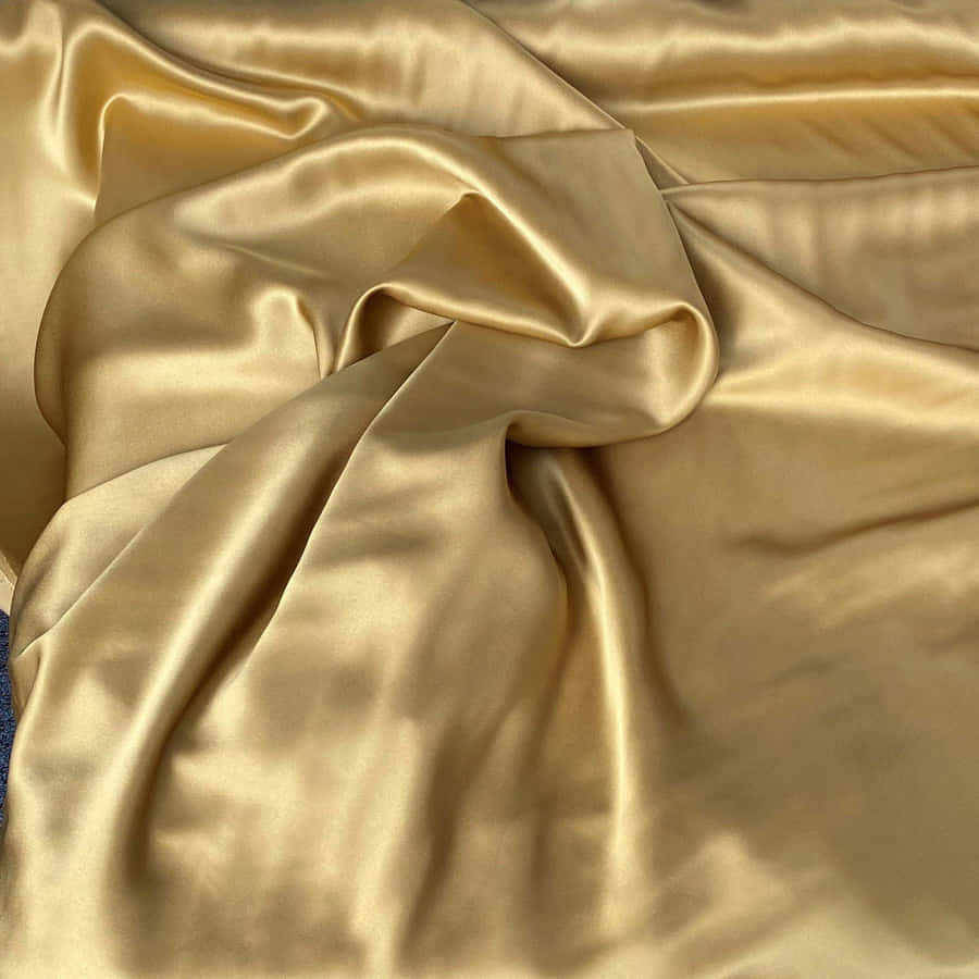 A Beautiful Warm-looking Fabric In Shades Of Gold And Yellow. Wallpaper