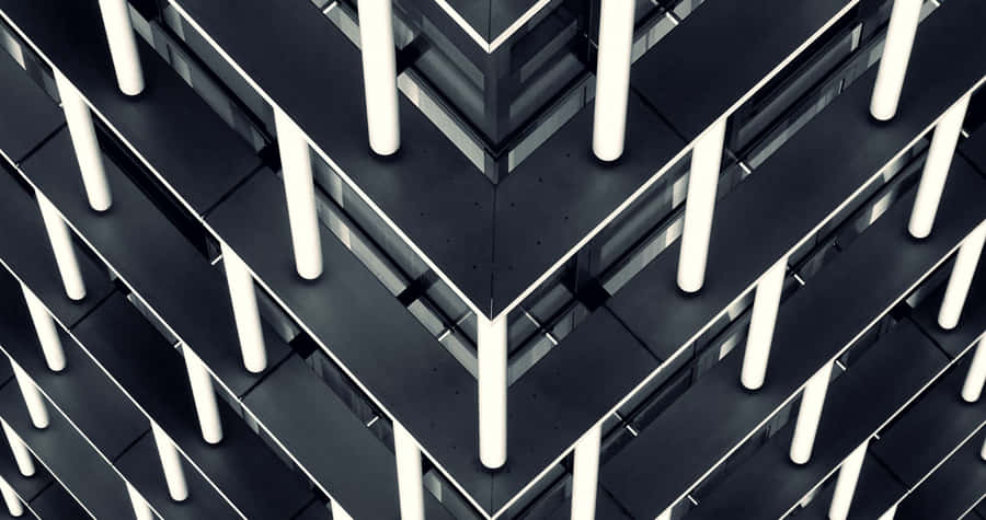 A Black And White Photo Of A Building With A Lot Of Lights Wallpaper