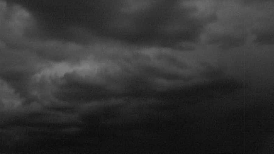 A Black And White Photo Of A Stormy Sky Wallpaper