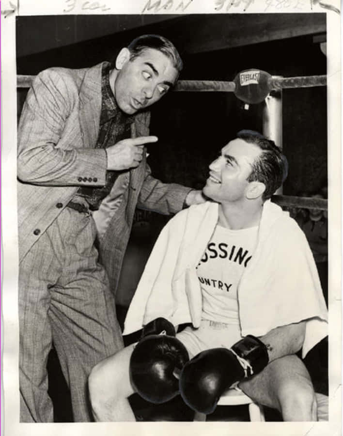 A Black And White Photo Of Two Men In Boxing Gloves Wallpaper
