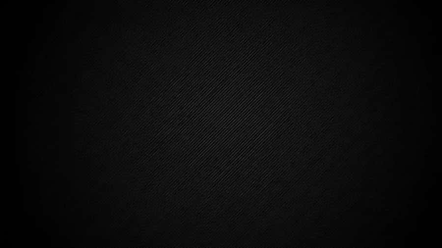 A Black Background With A Light Shining On It Wallpaper