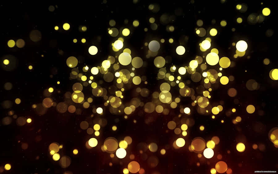 A Black Background With Gold Lights And Bokeh Wallpaper
