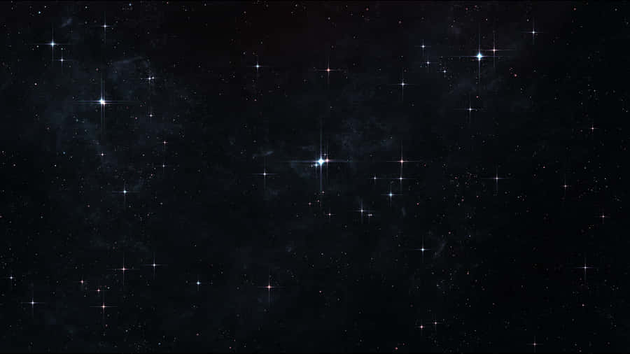 A Black Background With Stars And Stars Wallpaper