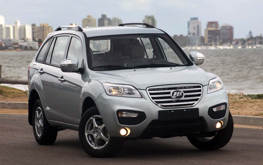 A Black Lifan Sport Motorcycle Parked On A City Street Wallpaper