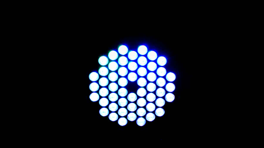 A Blue Light Is Shown In The Dark Wallpaper