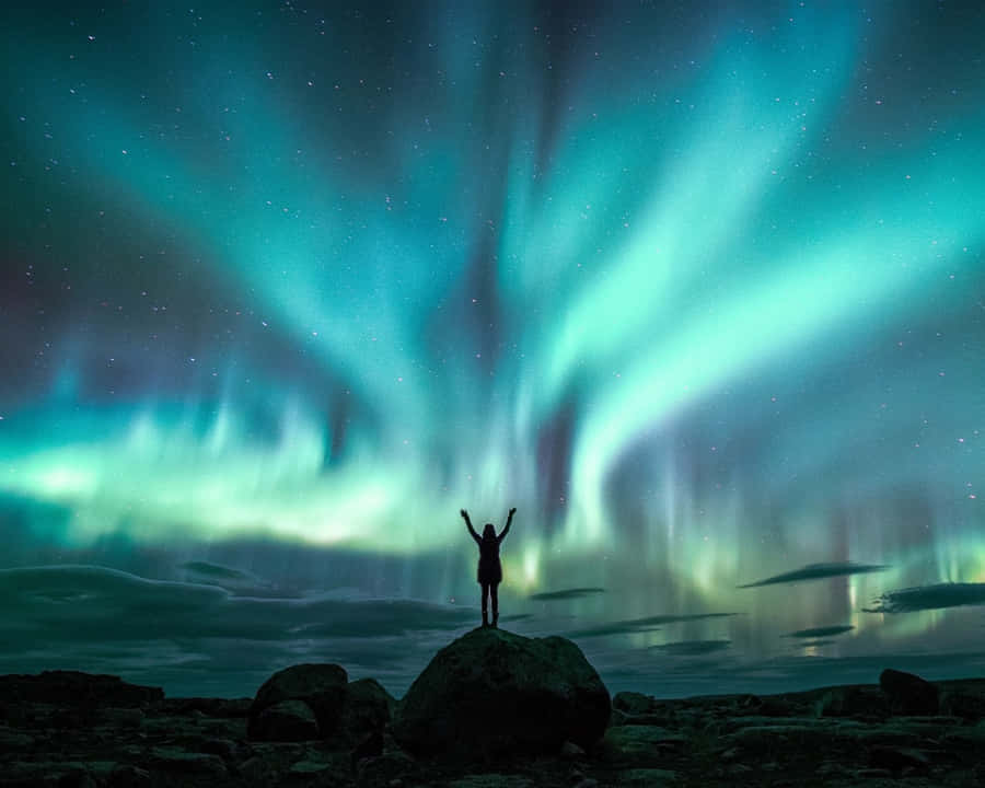 A Breathtaking Beautiful Star Shining Bright In The Dark Night Sky Wallpaper