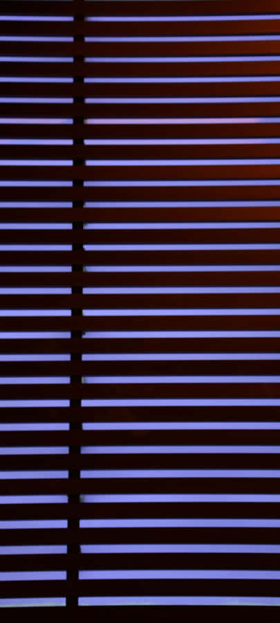 A Calm And Colorful Sunset Over The Ocean Wallpaper