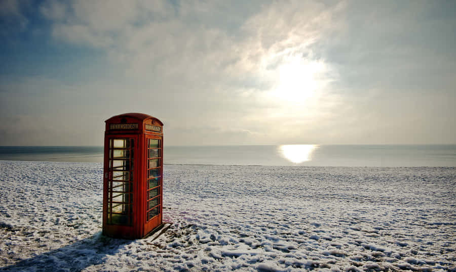 A Chilly Stroll On A Snowy Coastline Wallpaper