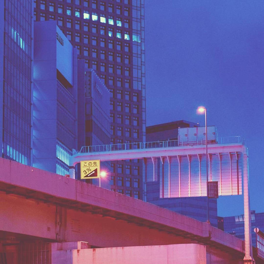 A City Street With A Bridge Wallpaper