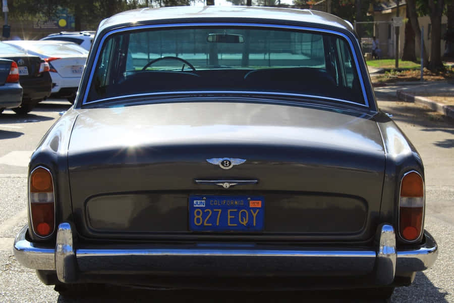 A Classic Bentley T1 Automobile In A Parking Lot Wallpaper