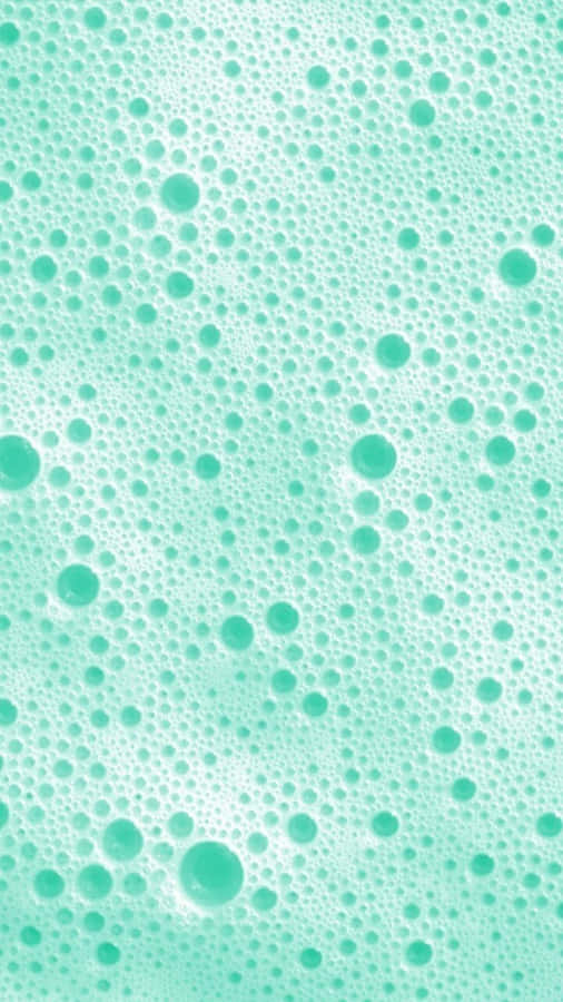 A Close Up Of A Green Bubbles In A Bath Wallpaper