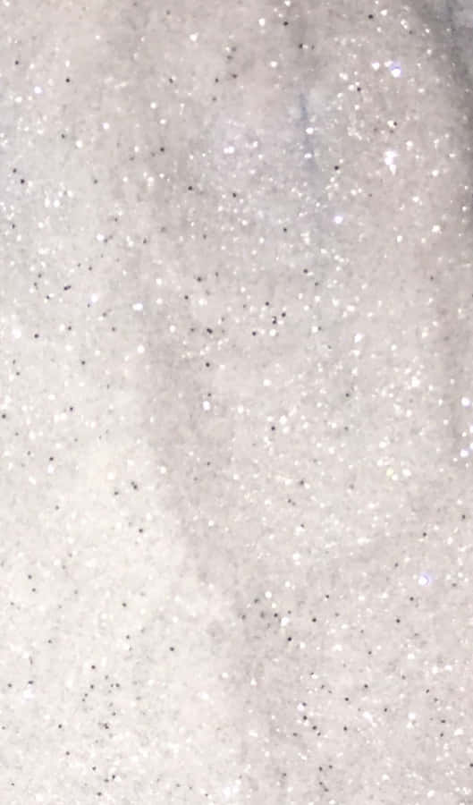 A Close Up Of A White And Silver Glitter Wallpaper