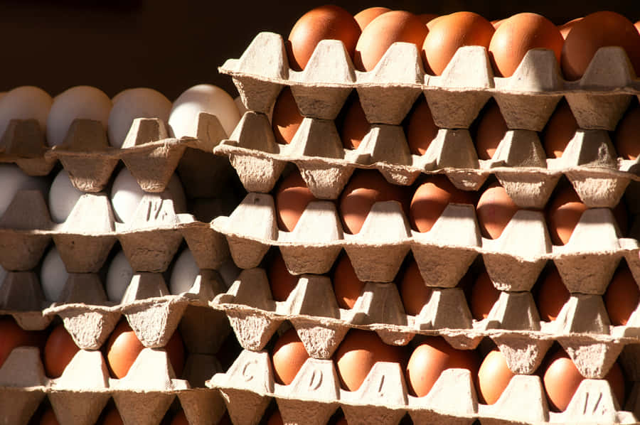 A Close-up Of Brown Eggs In A Carton Wallpaper