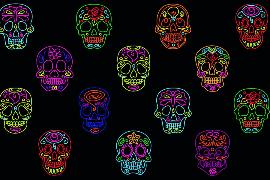 A Colorful Set Of Sugar Skulls On A Black Background Wallpaper