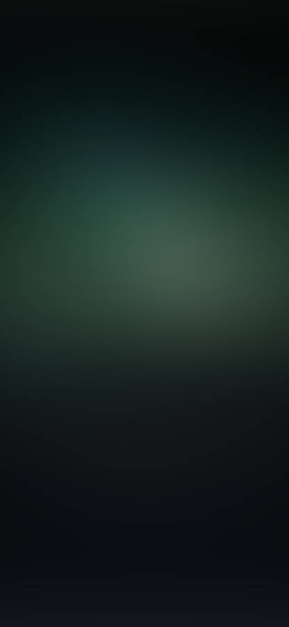 A Dark Green Background With A Blurred Background Wallpaper