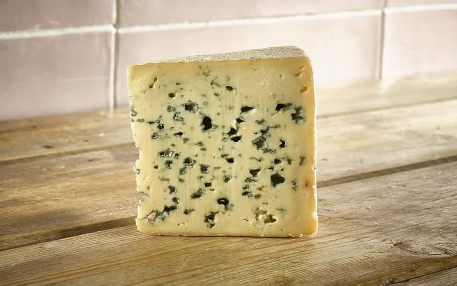 A Delicious Wedge Of Blue Cheese, Perfect For Salads Or Just For Snacking