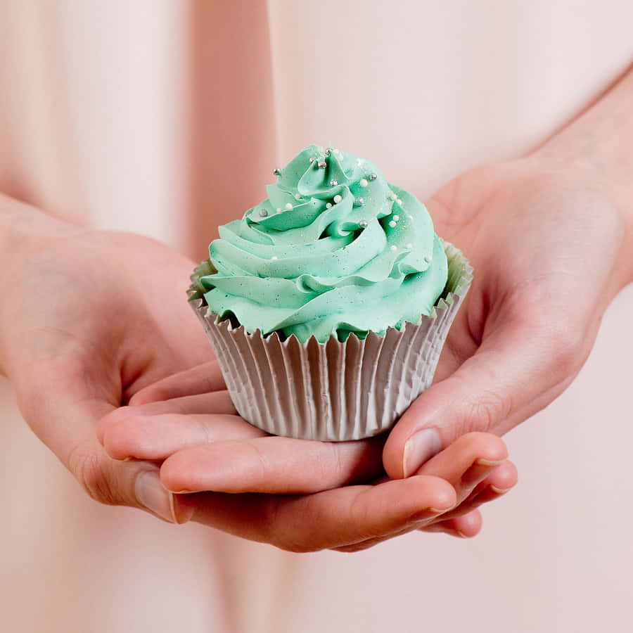 A Deliciously Adorable Cute Cupcake With A Pink Frosting Swirl And Sprinkles Wallpaper
