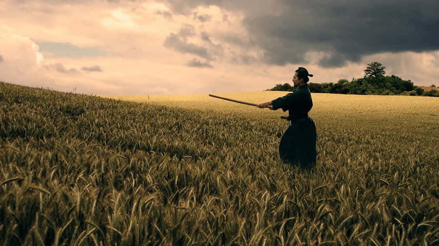 A Fierce Samurai Warrior In Battle Wallpaper