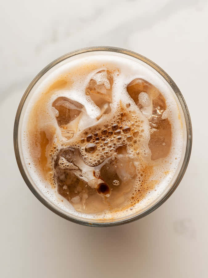 A Glass Of Coffee With Ice And Ice Cream Wallpaper