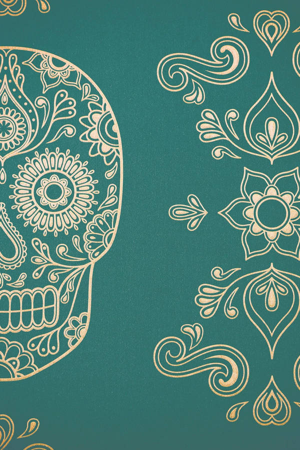 A Gold Sugar Skull On A Green Background Wallpaper