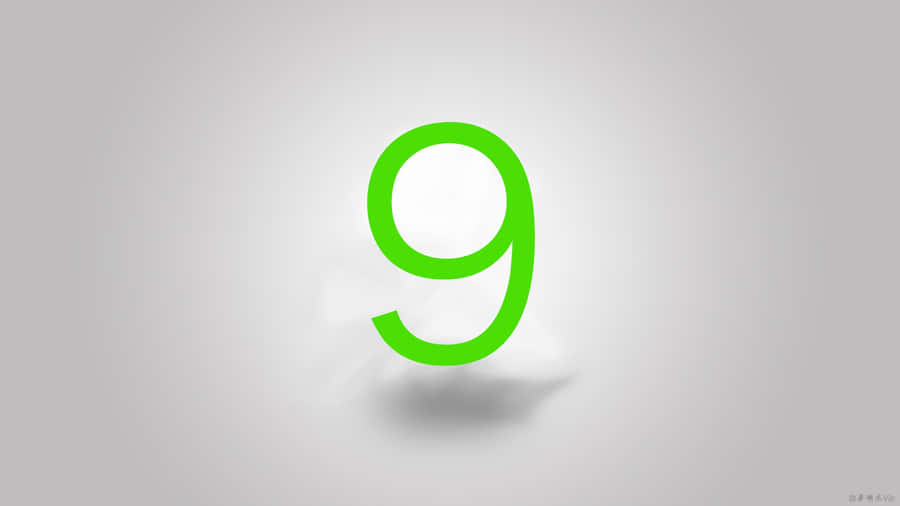 A Green Number 9 On A Gray Background Wallpaper