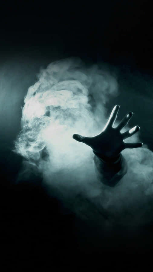 A Hand Is Reaching Out Of The Smoke Wallpaper