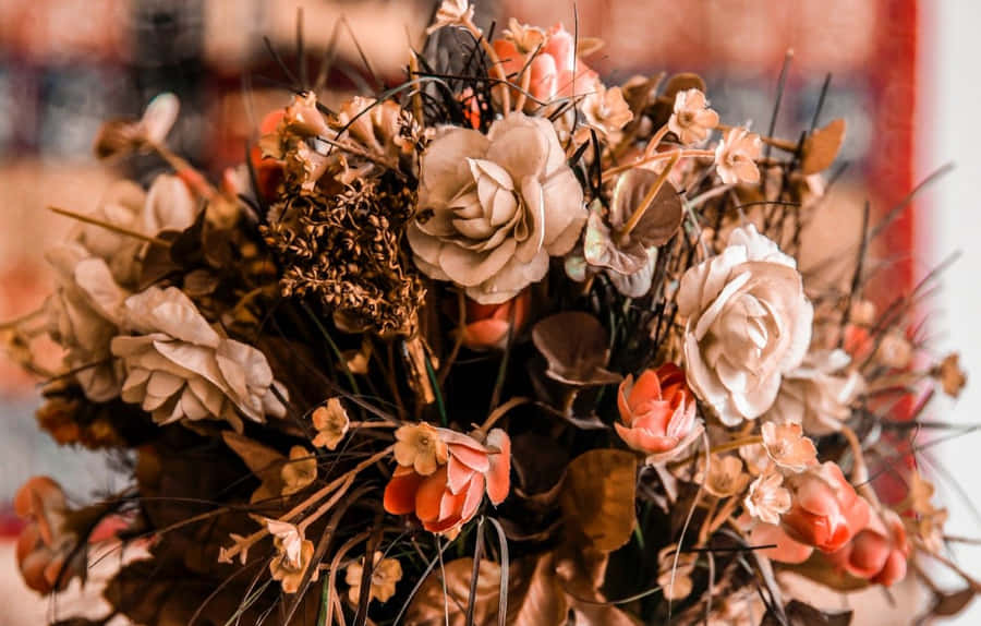 A Harmoniously Arranged Bouquet Of Yellow And Pink Roses. Wallpaper