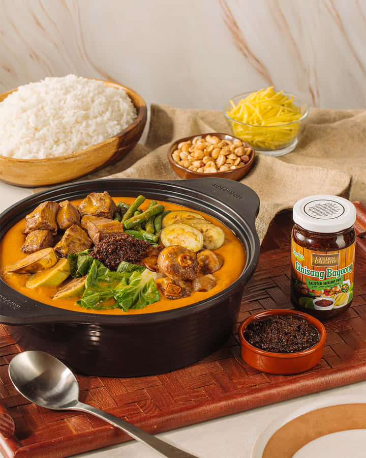 A Hearty Serving Of Traditional Kare-kare With Rice Wallpaper