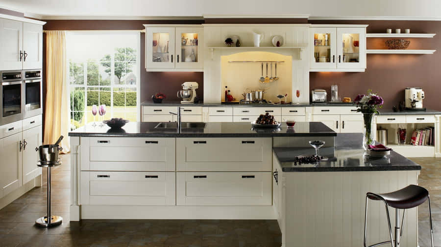 A Kitchen With A White Island And Stools Wallpaper