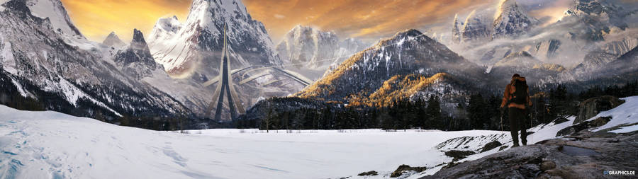 A Lone Hiker Admires A Majestic Mountain Range From Below. Wallpaper