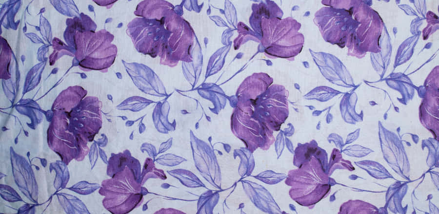 A Lone Hiker Stands Atop A Rocky Ridge Overlooking A Lush Green Valley Wallpaper